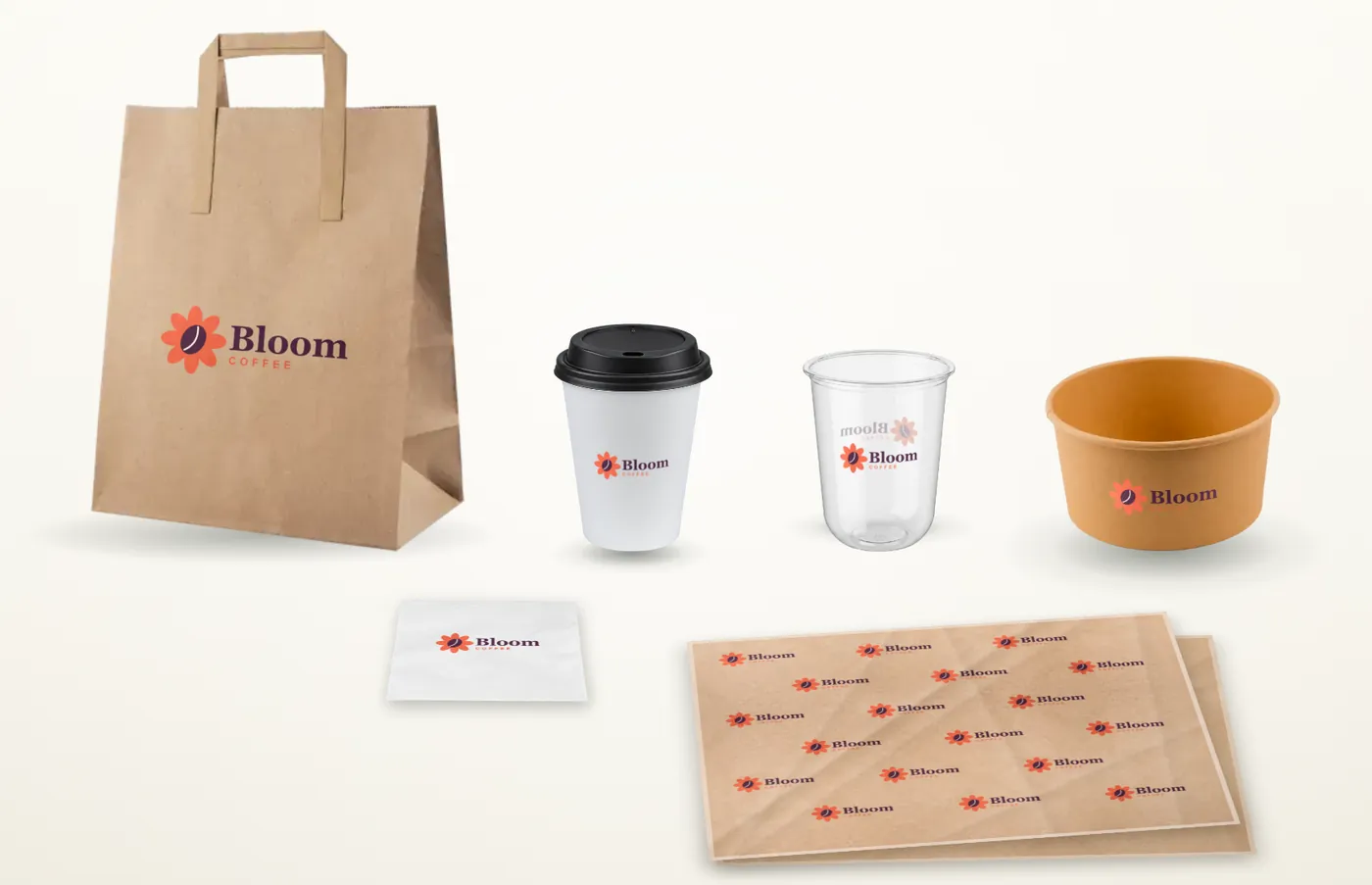 A packaging range made in Brand Studio with a sample logo: bag, hot cup, clear cup, bowl, napkin and greaseproof sheets